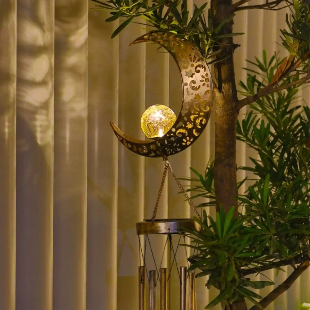 Lumière solaire suspendue pour jardin avec carillon éolien, s'allume automatiquement la nuit.
