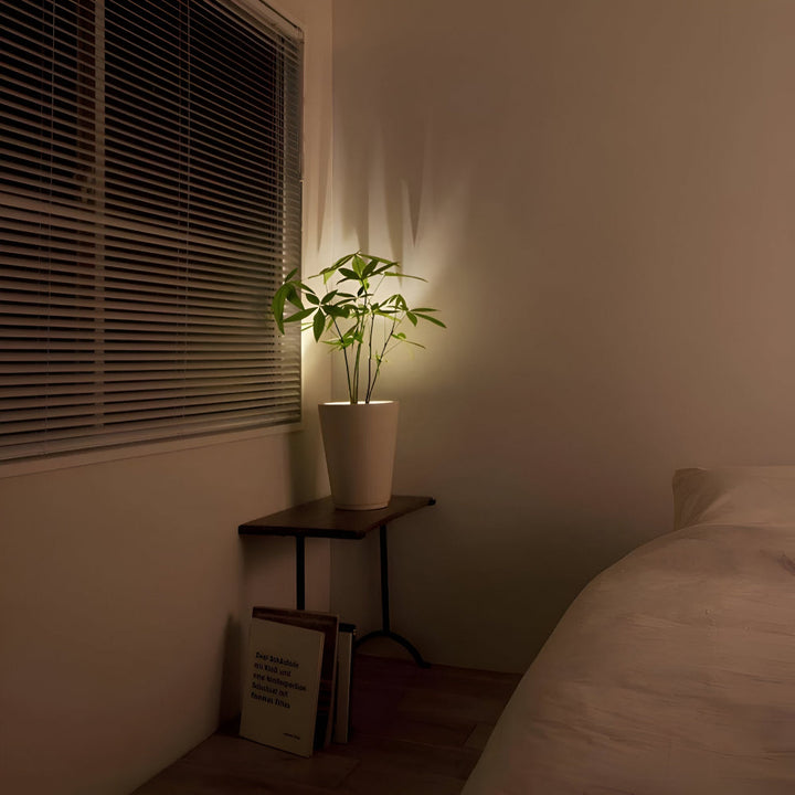 Projecteur LED orientable pour accentuer œuvres d'art ou objets décoratifs, avec télécommande.