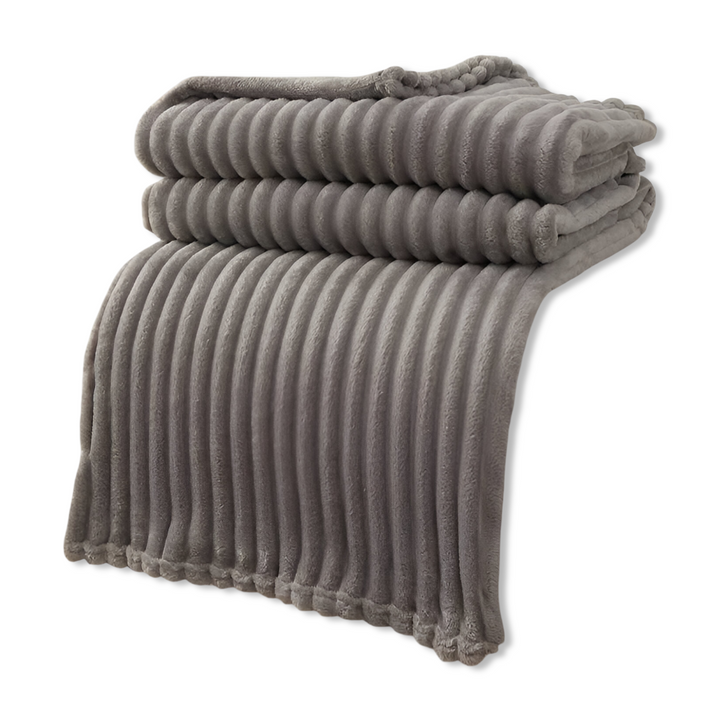 Couverture polaire confortable, douce, respirante, moments cocooning.