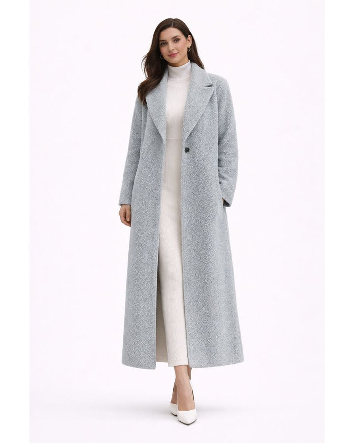 Manteau femme élégant et chaud, coupe oversize pour l'hiver. Tendance et confortable au quotidien.