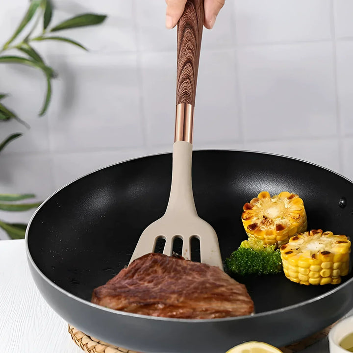 Collection élégante d'outils de cuisine en silicone pour pâtisserie et cuisson, design moderne et résistant à la chaleur.