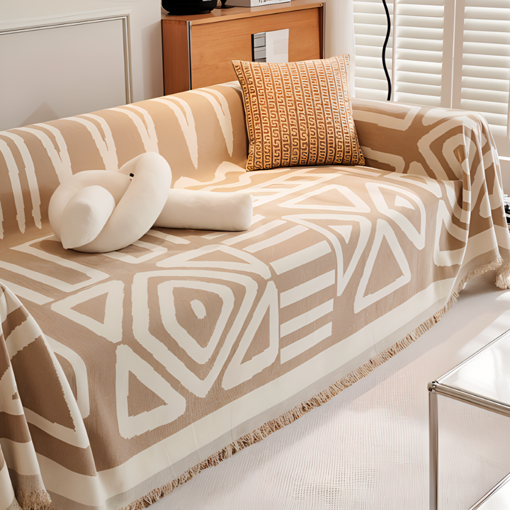 Housse de canapé antidérapante en chenille. Plaid douillet à franges, idéal pour la décoration de votre salon.
