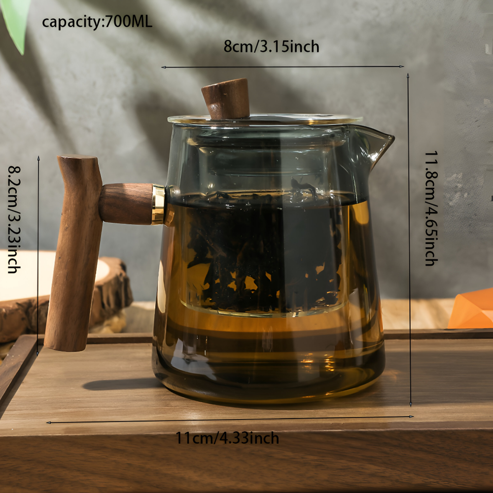 Sublime théière en verre avec infuseur intégré et poignée en bois. Ajoutez une touche élégante à votre cuisine.