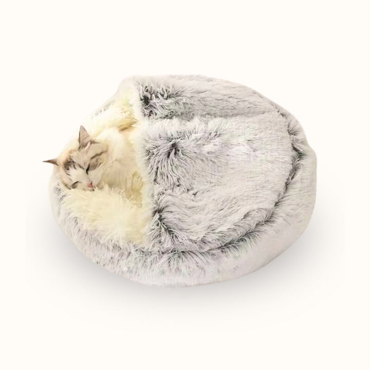 Lit anti-stress pour chat, forme cocon pour un repos apaisant et sécurisé, idéal sommeil.