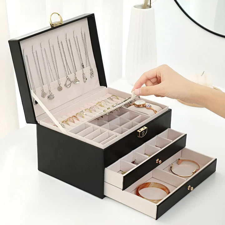 Boîte à bijoux multi-niveaux en cuir élégante pour femmes, rangement organisé et sécurisé.
