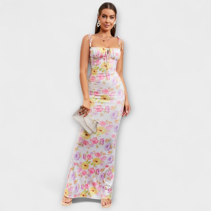 Robe fleurie longue, coupe sirène, avec bretelles nouées. Chic et idéale pour l'été.