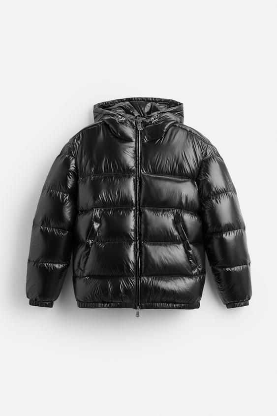 Doudoune unisexe noire chaude et stylée pour l'hiver. Idéale pour l'extérieur, confort et mode saisonnière.