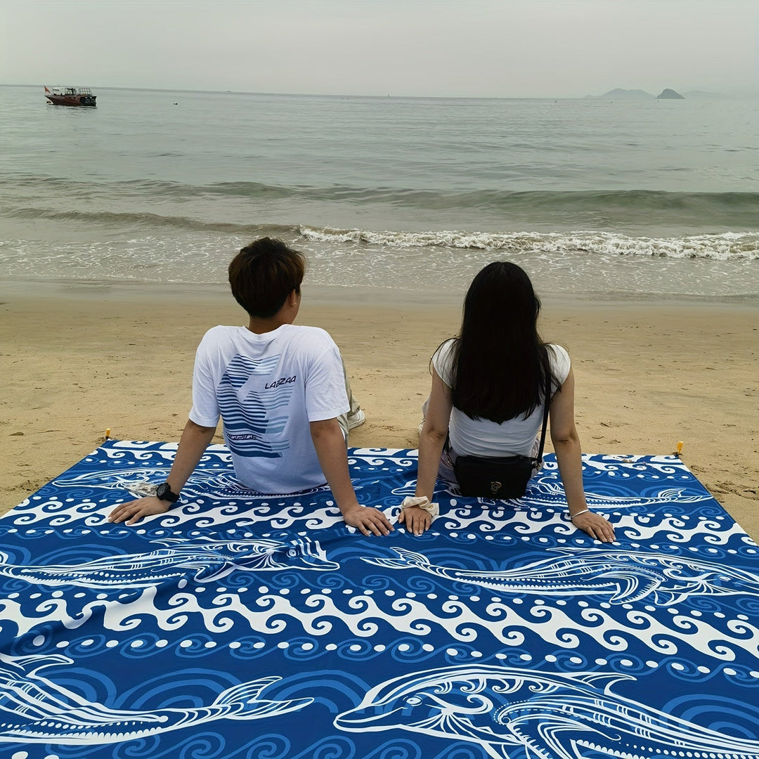 Tapis TropiComfort bleu, spacieux et résistant au sable, l'accessoire indispensable pour la plage.