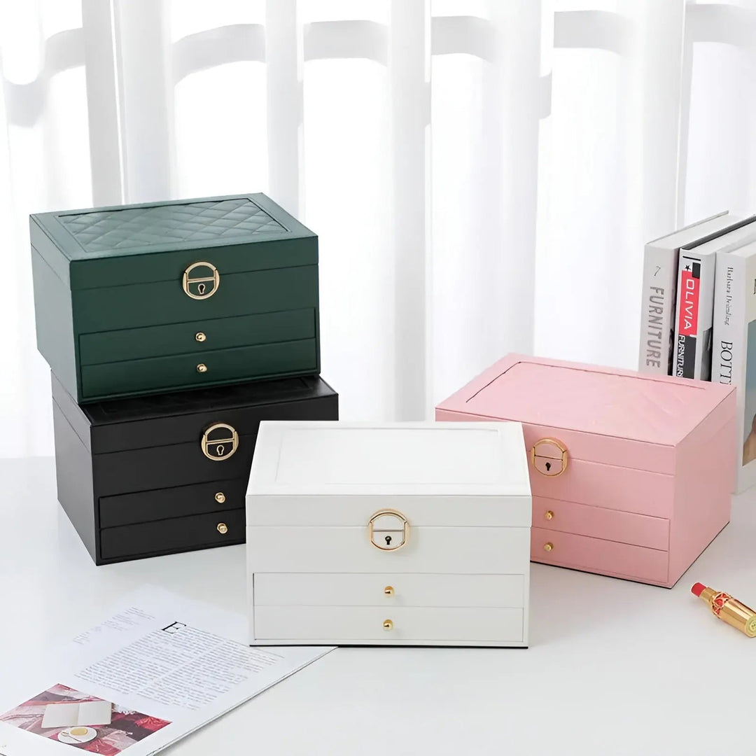 Boîte à bijoux multi-niveaux en cuir avec tiroirs et compartiments pour bagues, bracelets et montres.