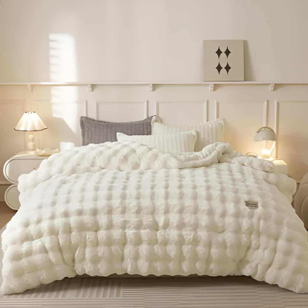 Literie de luxe: couette VelouraDream, chaleur et douceur enveloppantes pour un sommeil paisible.