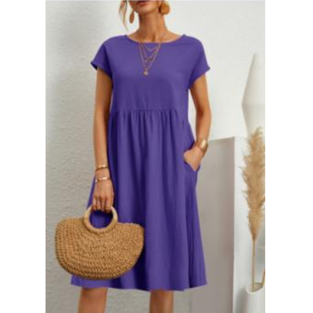 Robe femme chic et confortable, coupe empire pour l'été. Légère, manches courtes et poches indispensables.