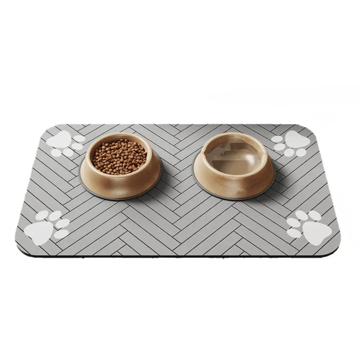 Tapis lavable et absorbant pour gamelles chat/chien. Facile d'entretien, garde le sol sec et propre des repas.