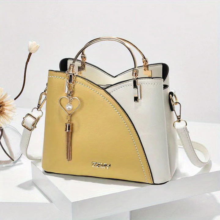 Sac à main femme en toile et cuir, accessoire mode chic et polyvalent pour le quotidien.