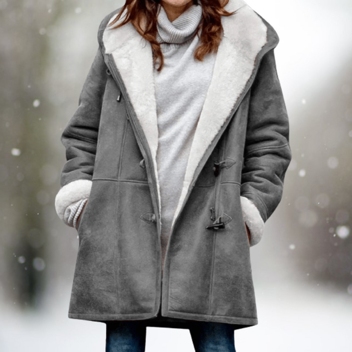 Manteau femme hiver chaud et élégant, coupe longue. Style chic et confort optimal.