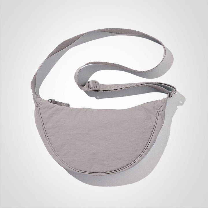 Sac à bandoulière quotidien décontracté, parfait pour transporter vos essentiels de voyage avec confort.