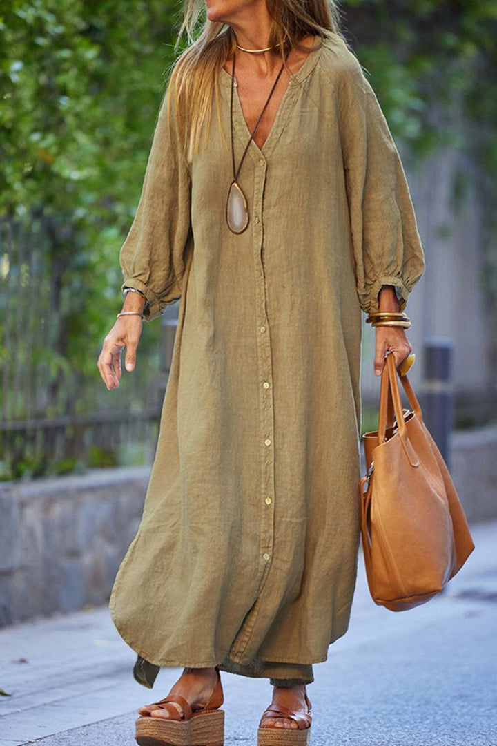 Robe femme élégante col V boutonnée, manches longues, parfaite pour le bureau ou soirée chic.