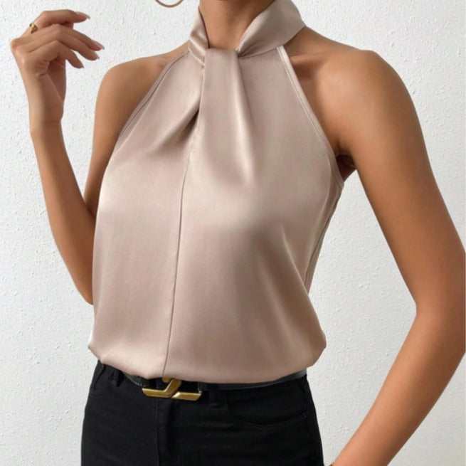 Blouse femme chic à col halter et nœud, parfaite pour une tenue élégante.
