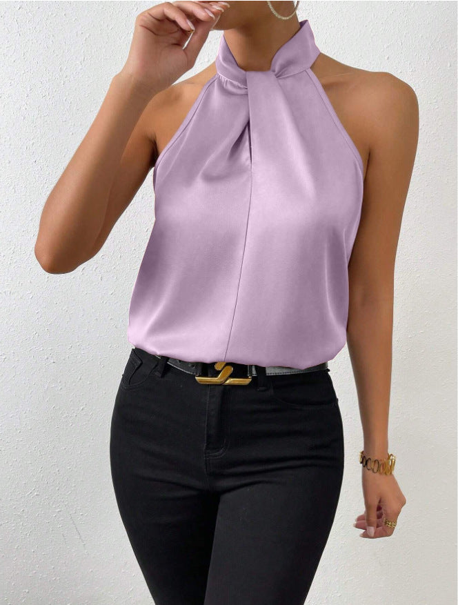 Haut de soirée femme col halter, nœud, coupe fluide, pour une allure sophistiquée.