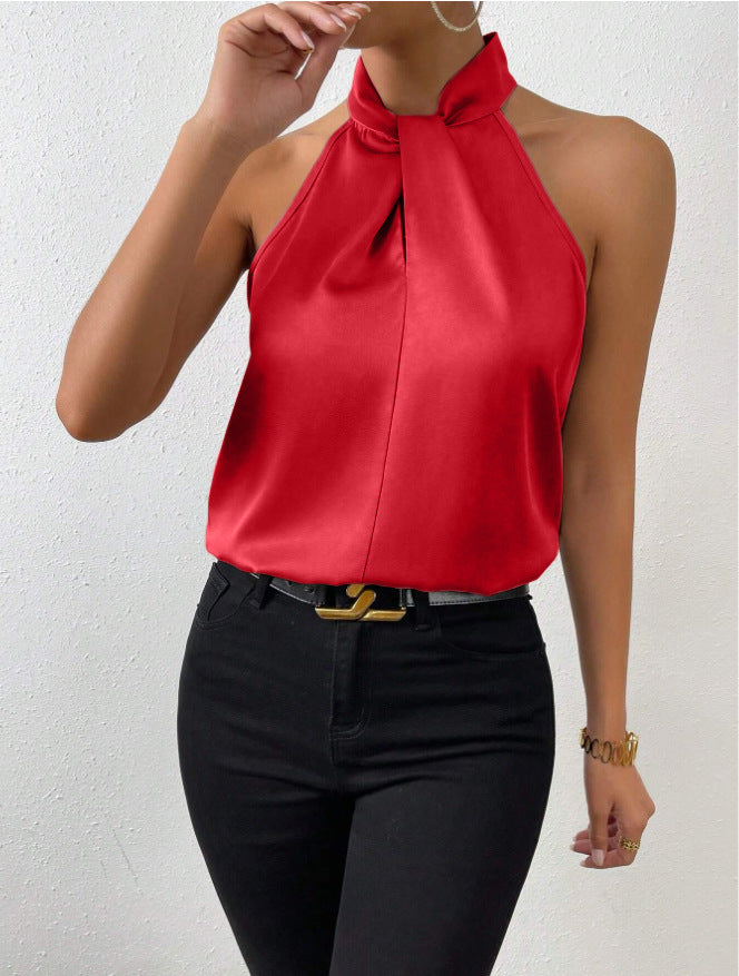 Blouse femme chic, col halter, coupe fluide en soie, idéale pour l'été.