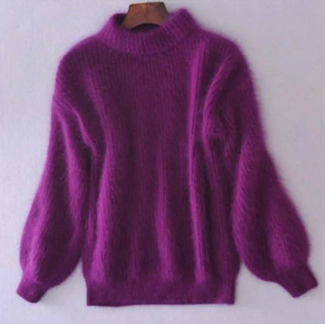 Pull femme cosy et confortable avec son col montant enveloppant et ses manches bouffantes chic. Parfait pour l'hiver.