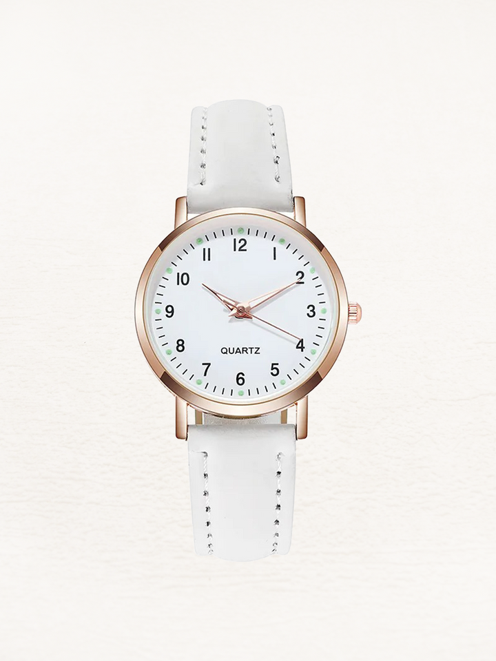 Montre femme quartz élégante, bracelet cuir or rose, cadran minimaliste. Accessoire mode féminine chic.