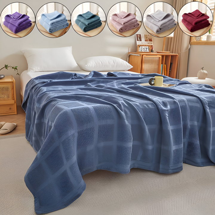 Couverture douce en coton hypoallergénique motif vichy, idéale pour lit et canapé.