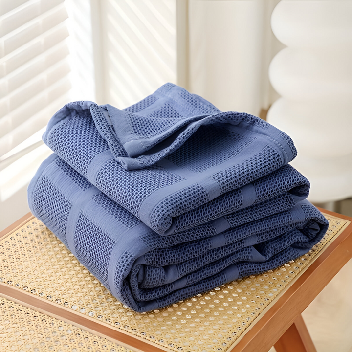 Plaid respirant en coton, motif vichy élégant, idéal pour un sommeil léger.