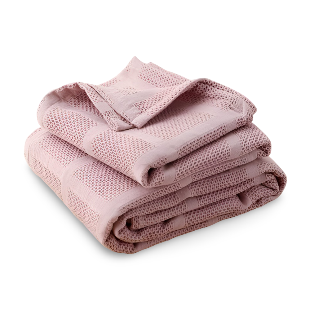 Jeté de canapé en coton léger, motif vichy, ajoute une touche décorative chic.