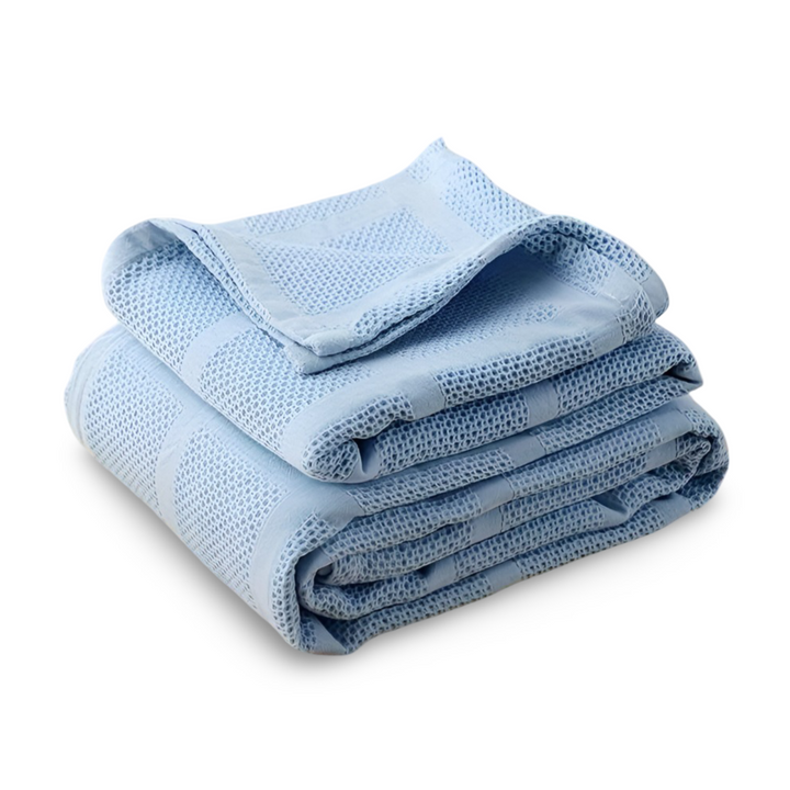 Jeté de lit en coton hypoallergénique, motif vichy, pour une chambre saine et stylée.