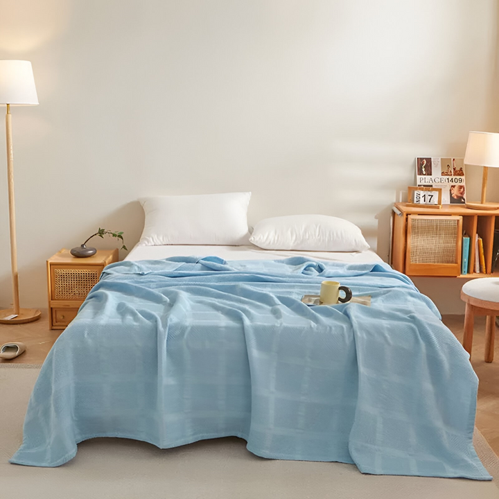 Couverture en coton douce et légère, motif vichy, parfaite pour le voyage.