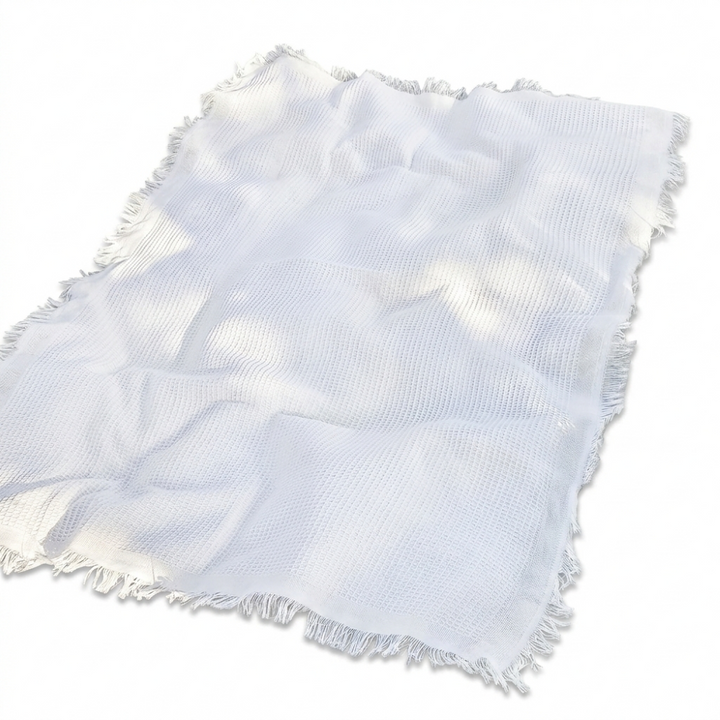Couverture de pique-nique blanche bohème lavable avec pompons pour jardin et extérieur.