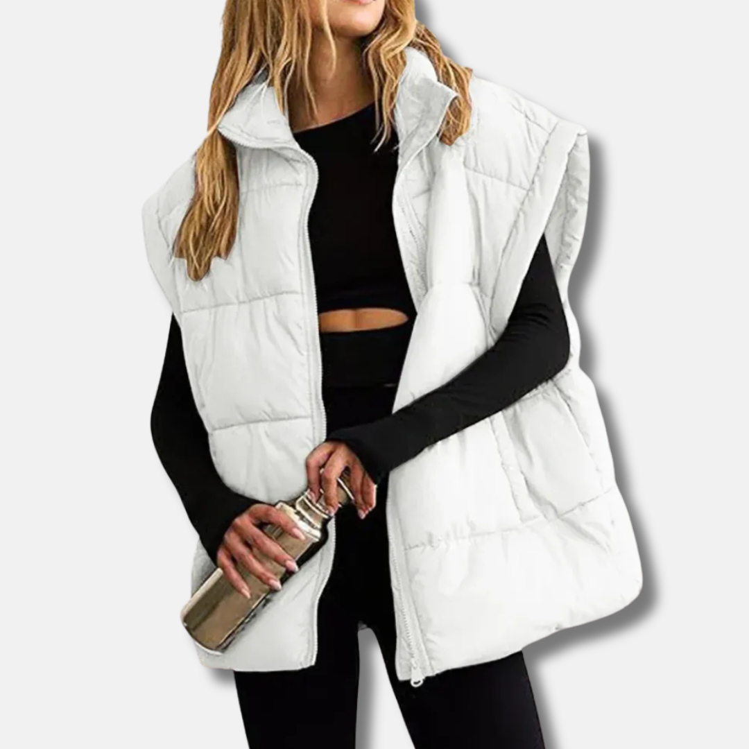 Veste femme matelassée sans manches, col montant, idéale mi-saison. Légère, chaude et stylée pour l'automne.