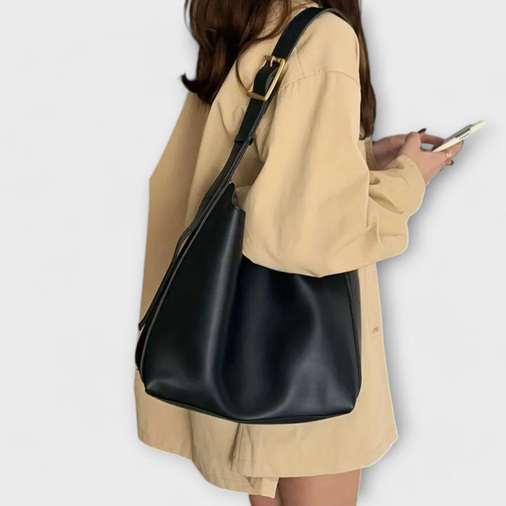 Sac bandoulière femme en cuir PU marron, accessoire de mode polyvalent, alliant élégance et confort quotidien.