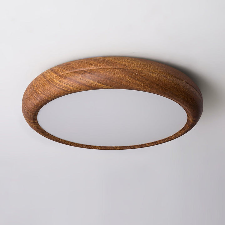 Plafonnier LED rond, design bois, parfait pour salle à manger moderne.