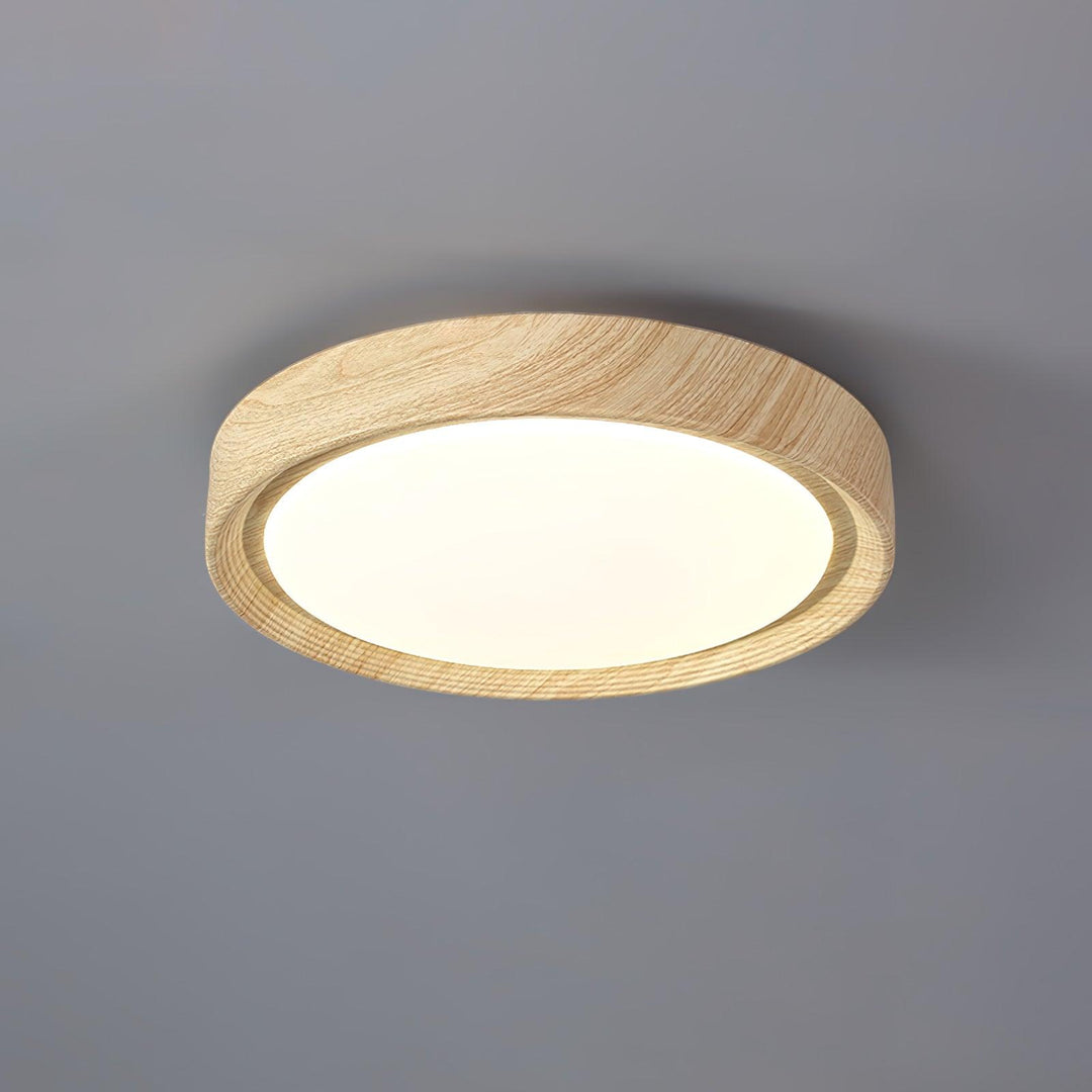 Éclairage LED rond, design épuré, finition bois clair.