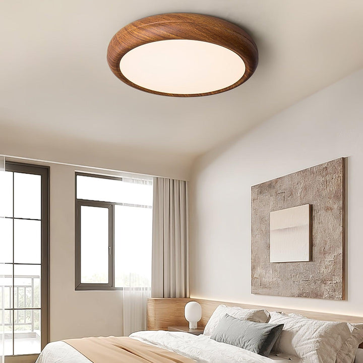 Plafonnier LED scandinave, aspect bois chaleureux, éclairage doux.
