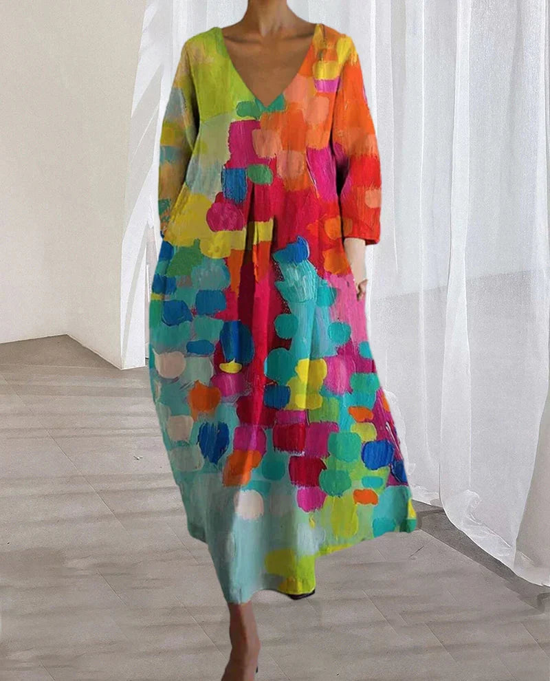 Robe d'été femme imprimée aux couleurs vibrantes, style casual chic. Décolleté V flatteur pour look mode.