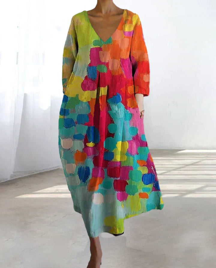 Robe femme imprimée, coupe élégante, décolleté en V. Parfaite pour un style mode féminin et vibrant en été.