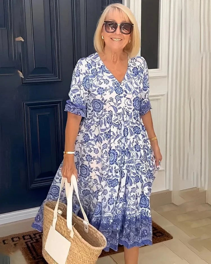 Robe longue fluide pour femme, imprimé floral, style estival chic et confortable. Vêtement polyvalent printemps/été.