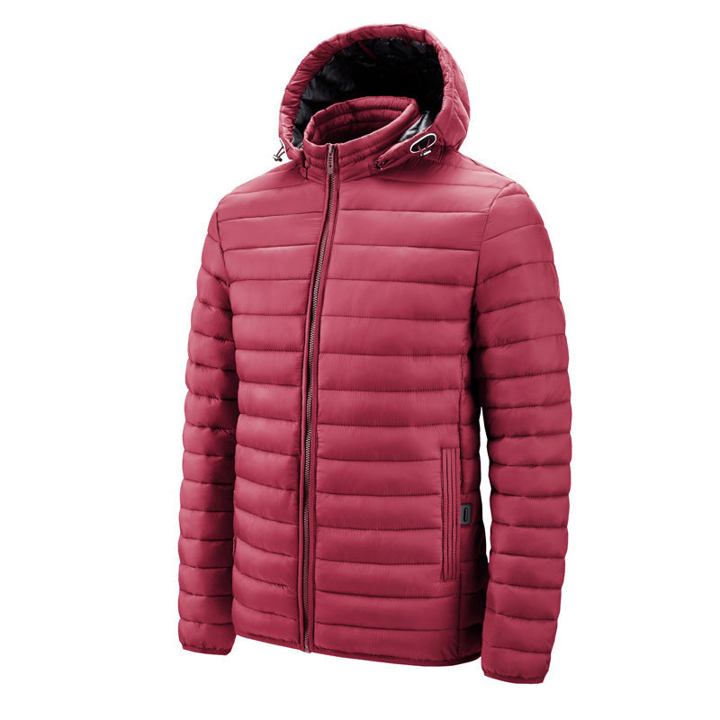 Homme portant une veste matelassée thermique pour homme en extérieur. Style urbain chic, parfaite contre le froid hivernal.