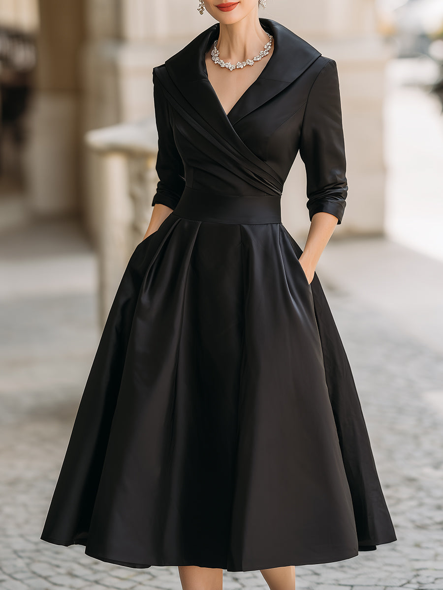 Robe midi plissée trapèze femme, style vintage chic, parfaite pour invitée de mariage élégante.
