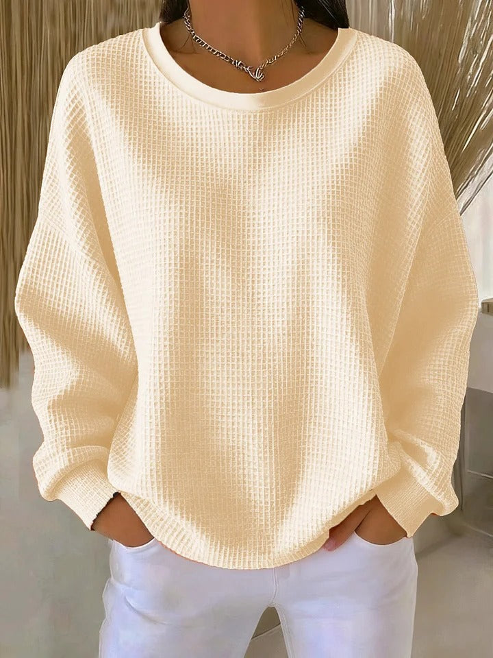 Manches longues du sweat-shirt femme texturé, pour un confort et une élégance décontractée.