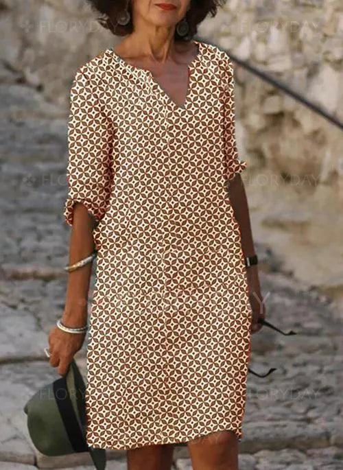 Robe femme fluide midi, couleur unie, pour un confort estival et un style chic décontracté. Parfaite pour l'été.