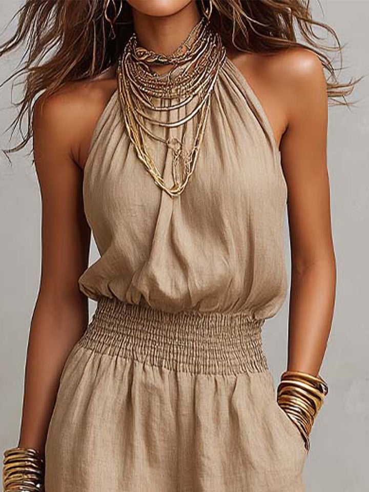 Silhouette élégante avec cette combinaison fluide femme halter à jambes larges. Confortable et chic.
