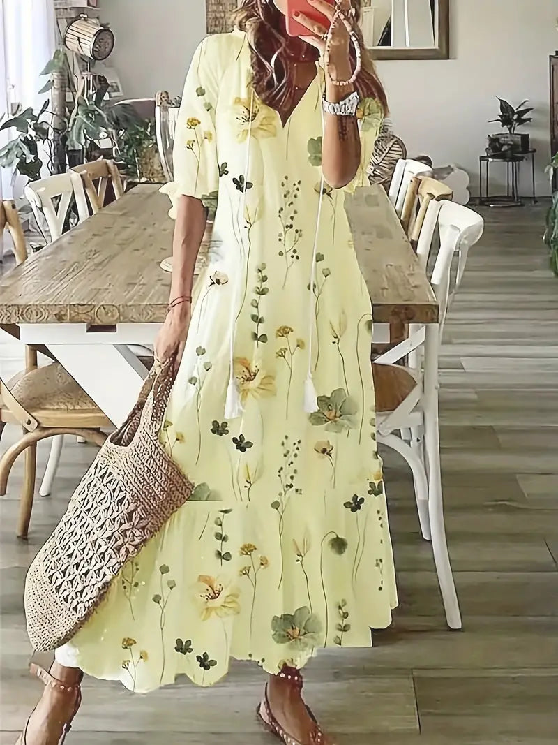 Robe fluide femme, imprimé ikat, col V et volants, mode bohème chic pour l'été.