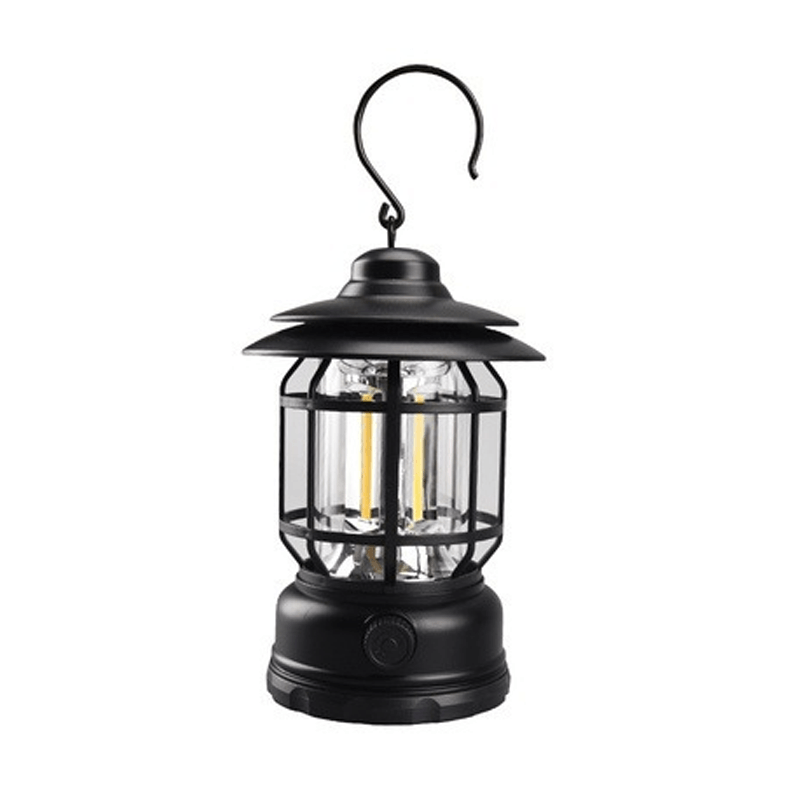 Lumière douce de lampe camping vintage portable, créant une ambiance rétro pour jardin et terrasse.