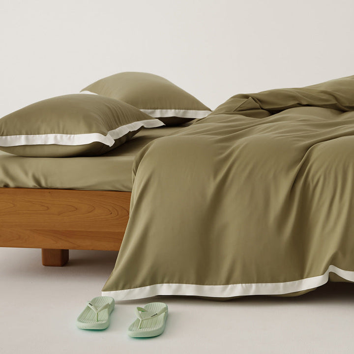 Literie Tencel patchwork moderne, luxueuse et respirante, parfaite pour une chambre élégante et confortable.