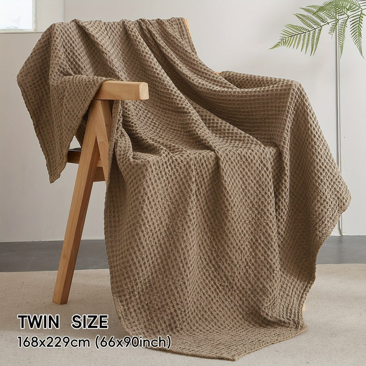 Plaid Cloudweave doux au toucher, motif gaufré moderne, parfait pour se réchauffer avec élégance.