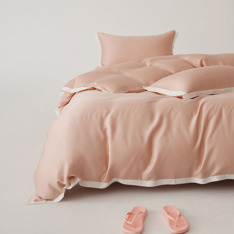 Ensemble de literie Tencel doux, respirant et luxueux, avec motif patchwork pour chambre moderne et confortable.