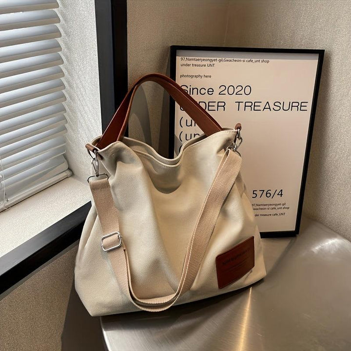 Sac casual en toile résistante, bandoulière ajustable. Accessoire mode pratique et polyvalent.